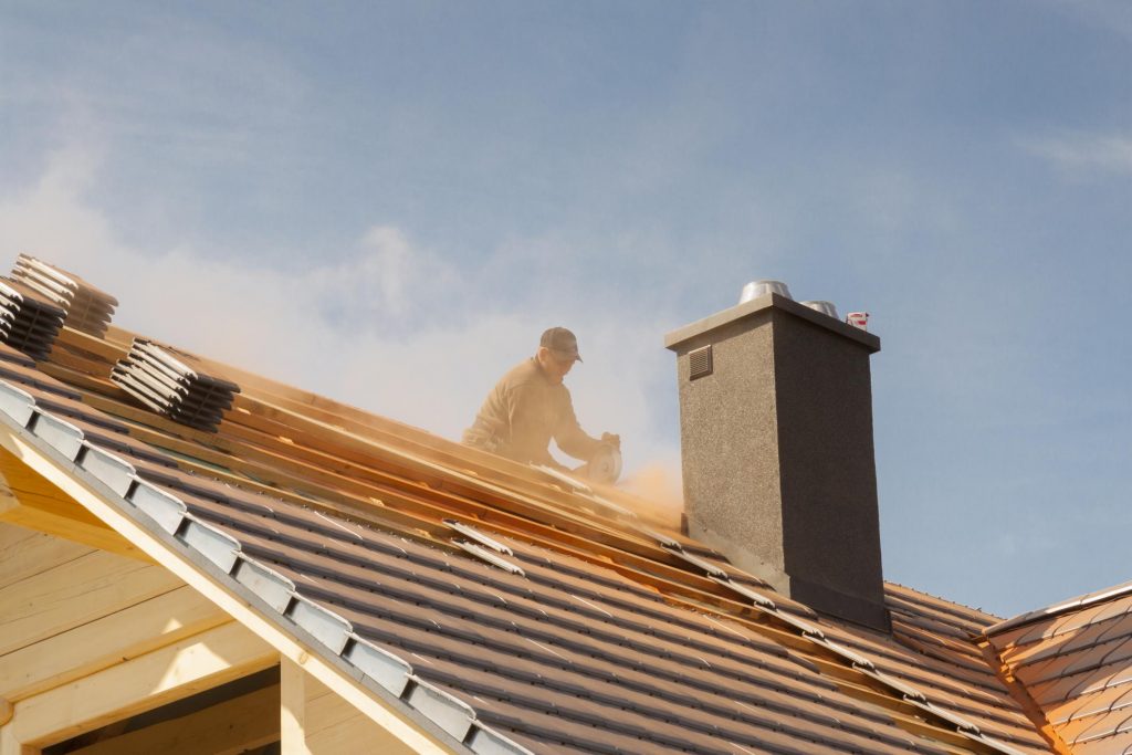 roofer installing house roof